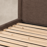 Brown upholstered bed frame featuring a high headboard and wooden slats.