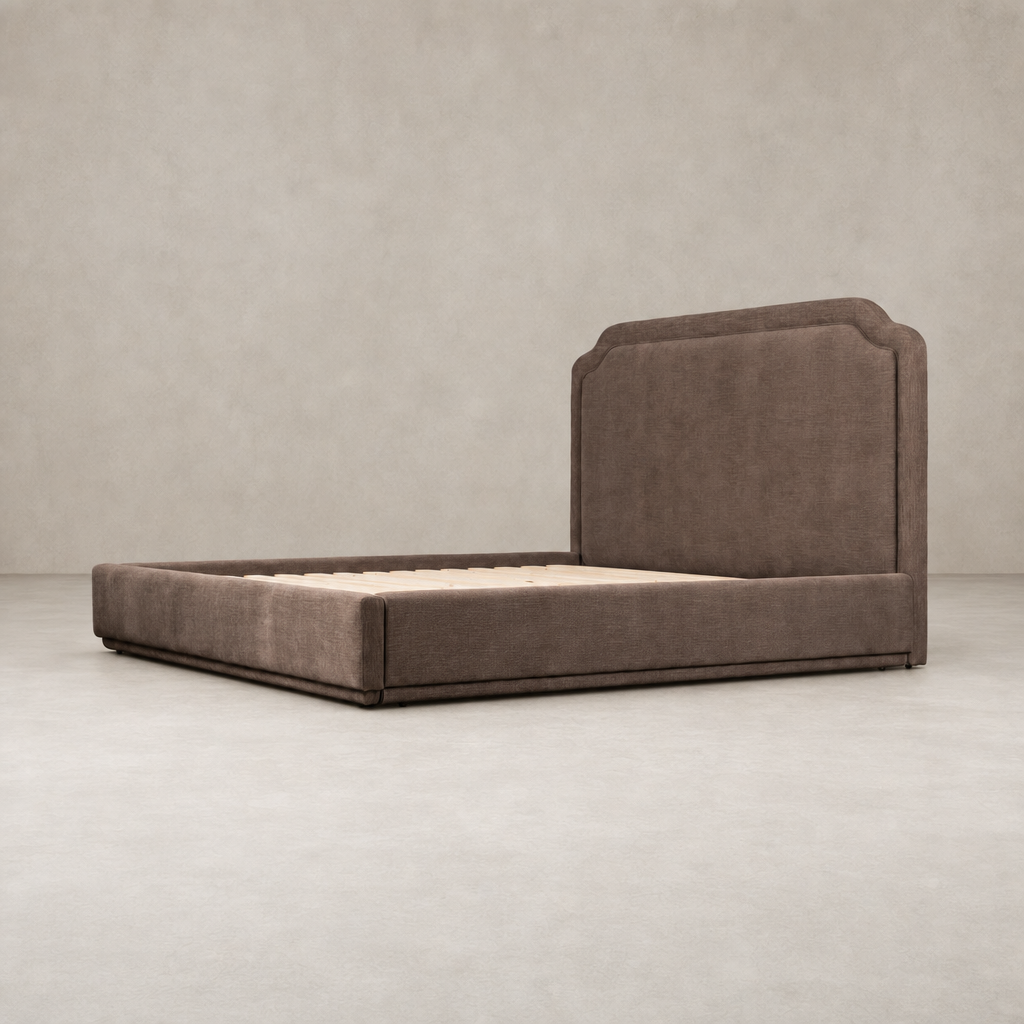 Elegant bed in Laughlin Cafe upholstery with a stylish curved headboard.