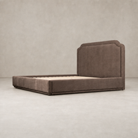 Elegant bed in Laughlin Cafe upholstery with a stylish curved headboard.