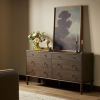Dark brown Sungkai six drawer dresser with sleek handles in a stylish room setting.