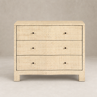 Natural fleck raffia nightstand with three spacious drawers and sleek design.