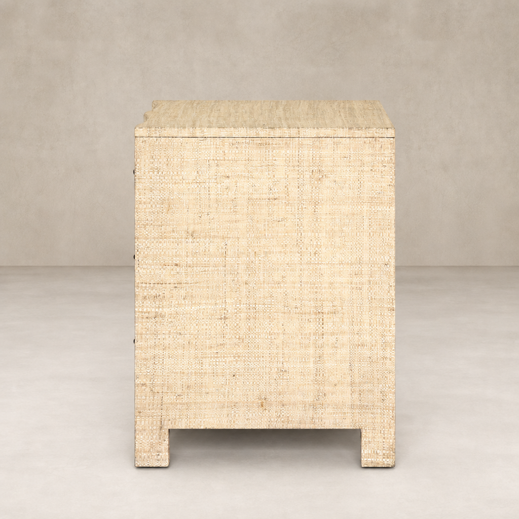 Natural Fleck Raffia nightstand with textured finish and minimalistic design.