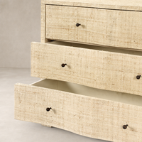 Natural Fleck Raffia nightstand featuring two spacious drawers and sleek round knobs.