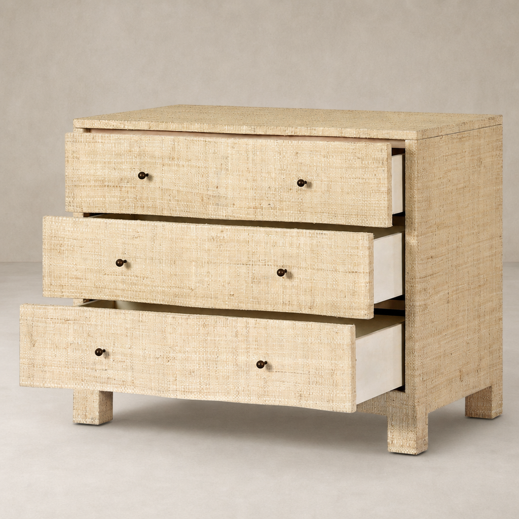 Natural Fleck Raffia nightstand with three spacious drawers and minimalist design.