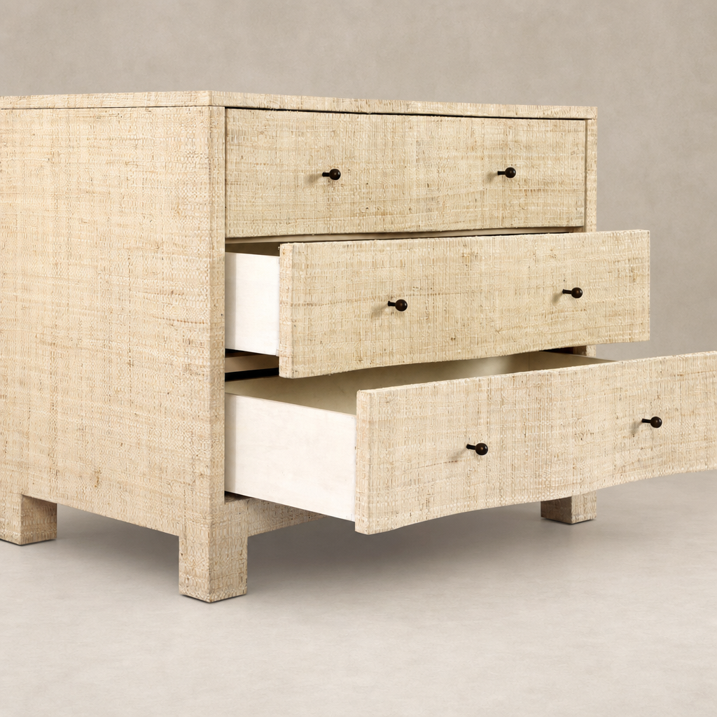 Natural Fleck Raffia nightstand with three spacious drawers and textured finish.