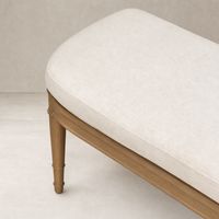 Stylish accent bench in Crypton Nomad Snow with elegant wooden legs.