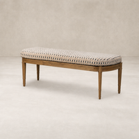 Elegant accent bench in Firefinch Fawn with a padded woven seat and wooden legs.
