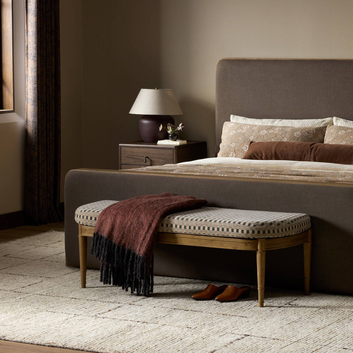 Stylish accent bench in Firefinch Fawn with patterned upholstery and wooden legs.