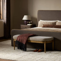 Stylish accent bench in Firefinch Fawn with patterned upholstery and wooden legs.