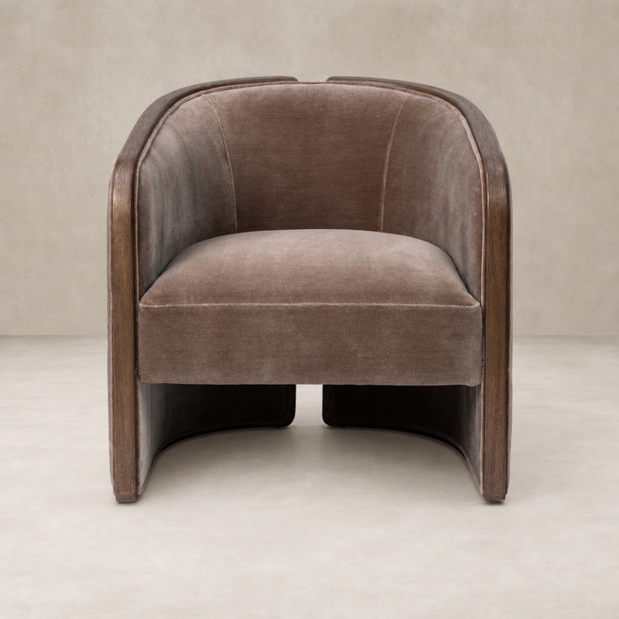 Monte Mushroom accent chair featuring soft fabric and sleek wooden sides.