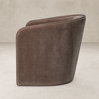 Stylish Monte Mushroom accent chair with a sleek curved design and soft fabric upholstery.