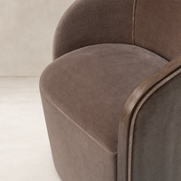 Soft Monte Mushroom accent chair featuring rounded edges and wooden armrests.