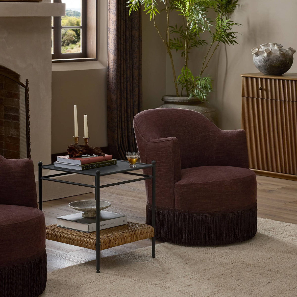 Lyra Fringe Swivel Chair in Laughlin Plum, featuring plush upholstery and stylish fringe detail.