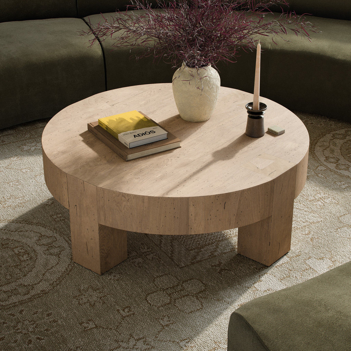 Bergen Round Coffee Table in whitewash rustic wormwood oak with a smooth, rounded top.
