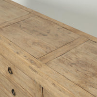 Detail of the Bruna Weathered Sideboard showcasing its rustic wood finish and natural grain patterns.