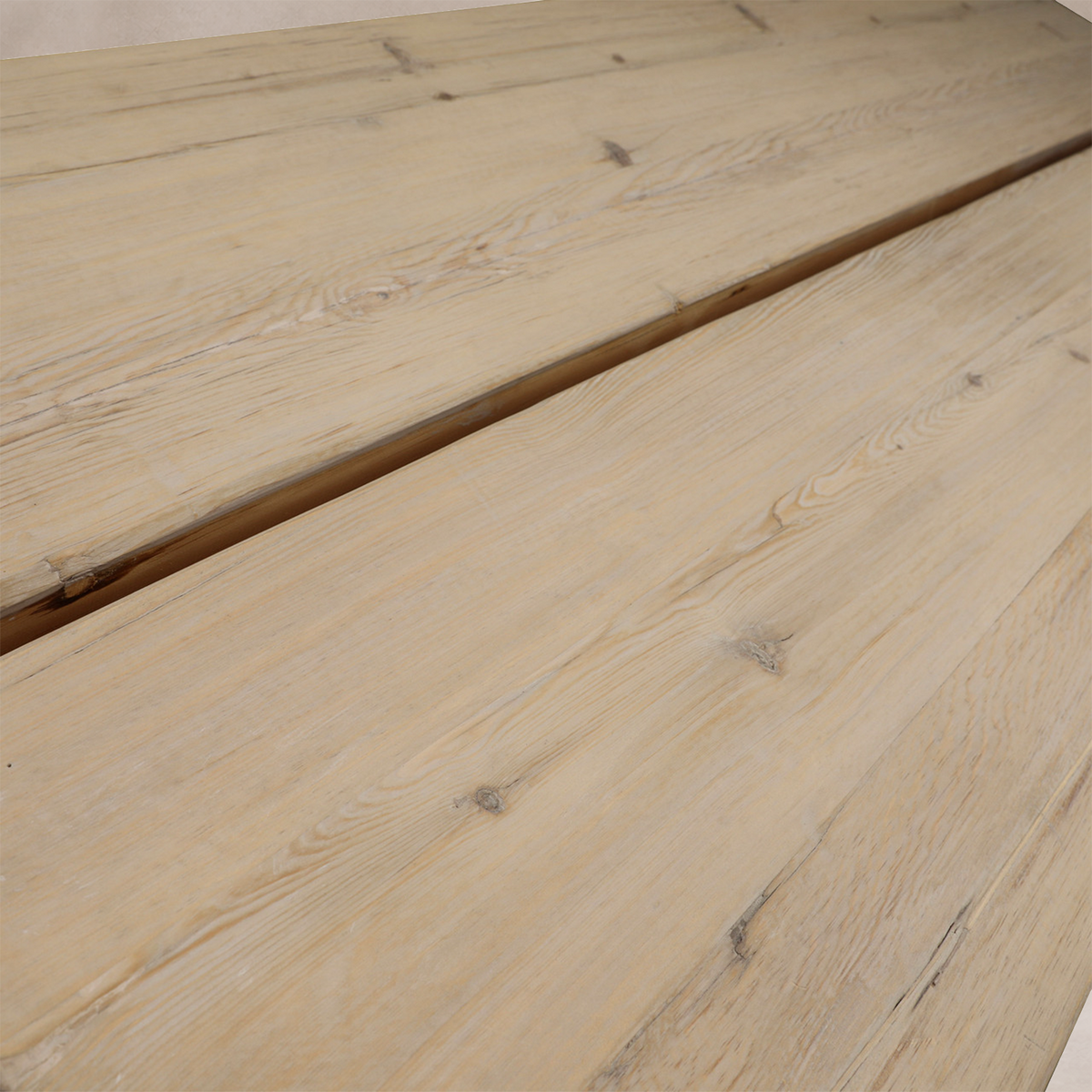 Close-up of the Granada Vintage Elm Dining Table showcasing its natural wood grain and rustic finish.