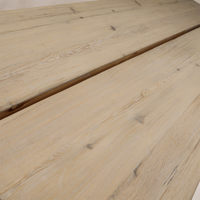 Close-up of the Granada Vintage Elm Dining Table showcasing its natural wood grain and rustic finish.