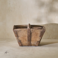 Front view of a vintage 19th-century rice bucket, featuring wooden construction and metal accents.