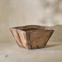 Side angle of a vintage 19th-century rice bucket, showcasing its rustic wooden construction and unique shape.