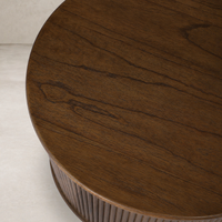 Close-up of the Luna End Table's rich wood grain and textured side detailing.