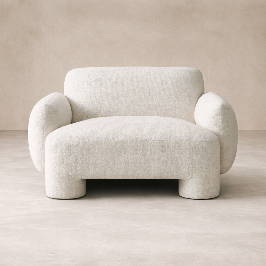 Front view of the Elba Accent Chair showcasing its soft, rounded design and textured fabric.