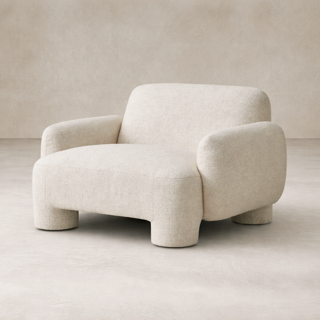 Front view of the Elba Accent Chair in soft, textured fabric, featuring rounded arms and a cozy silhouette.