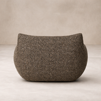 Back view of the Ciel Swivel Chair, showcasing its rounded shape and textured brown fabric.