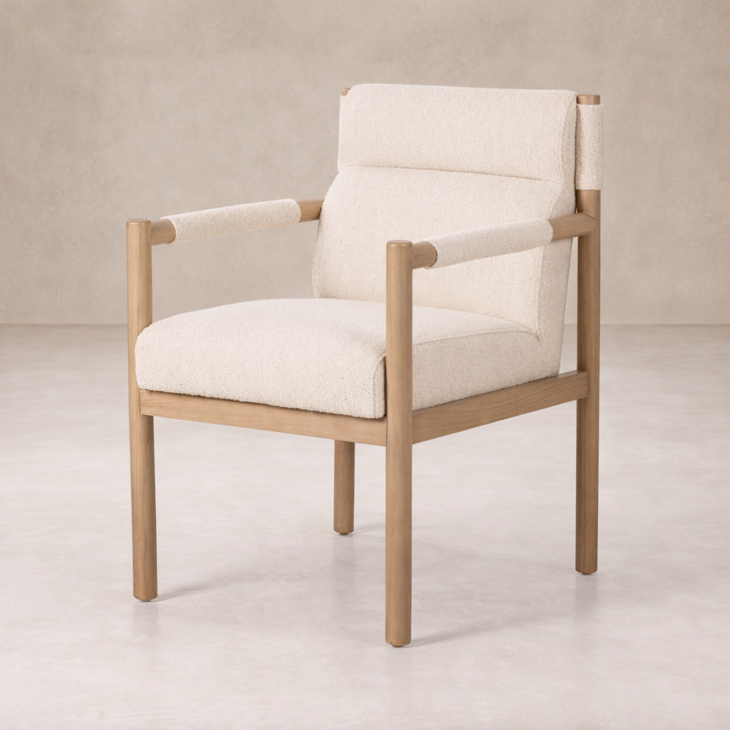Close-up of the Sorrento Dining Chair featuring a plush cream upholstery and natural wood frame.