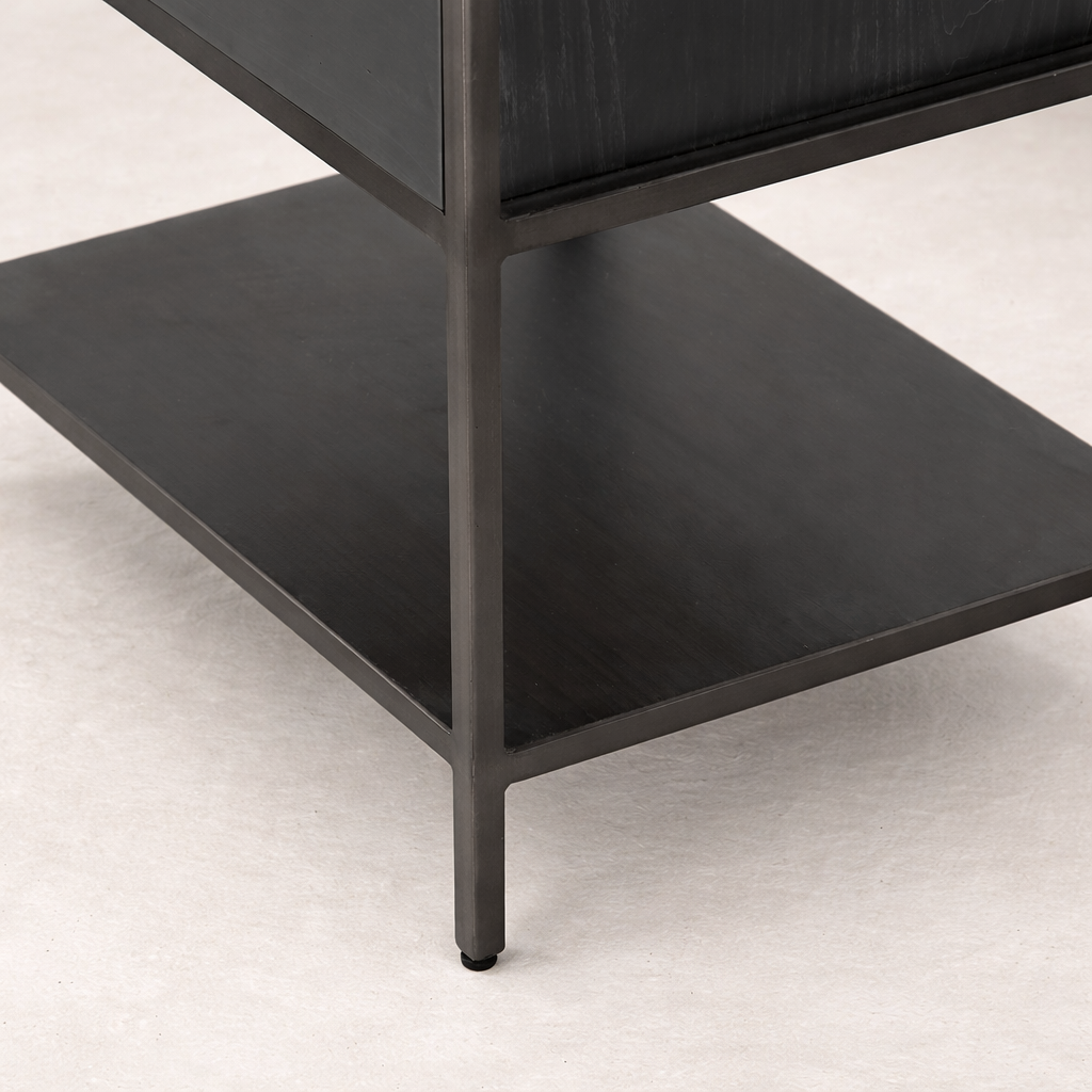 Close-up of the Ellis Narrow Bookcase's sleek metal frame and dark wood shelves.