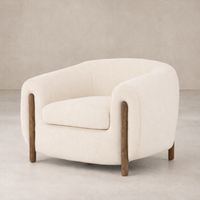 Close-up of the Laurel Accent Chair featuring soft upholstery and sturdy wooden legs.