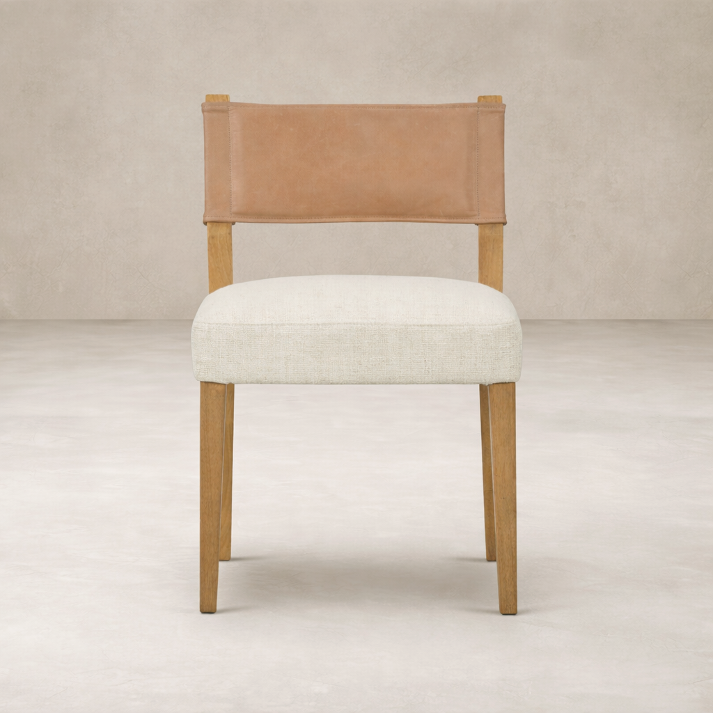 Front view of the Roseto Dining Chair featuring a leather back and soft fabric seat.