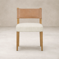 Front view of the Roseto Dining Chair featuring a leather back and soft fabric seat.