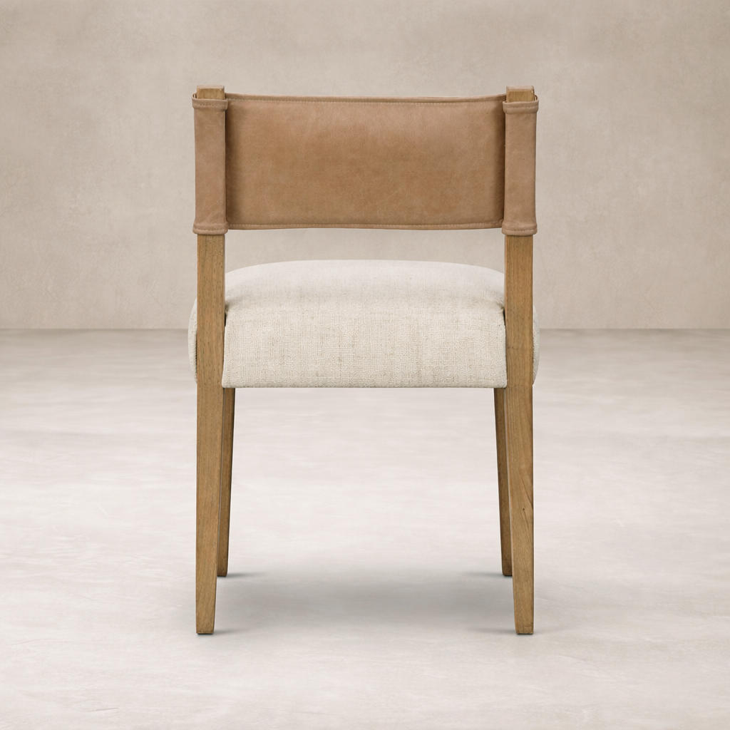 Back view of the Roseto Dining Chair, featuring a leather backrest and soft fabric seat.