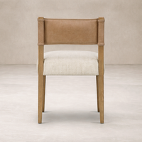 Back view of the Roseto Dining Chair, featuring a leather backrest and soft fabric seat.