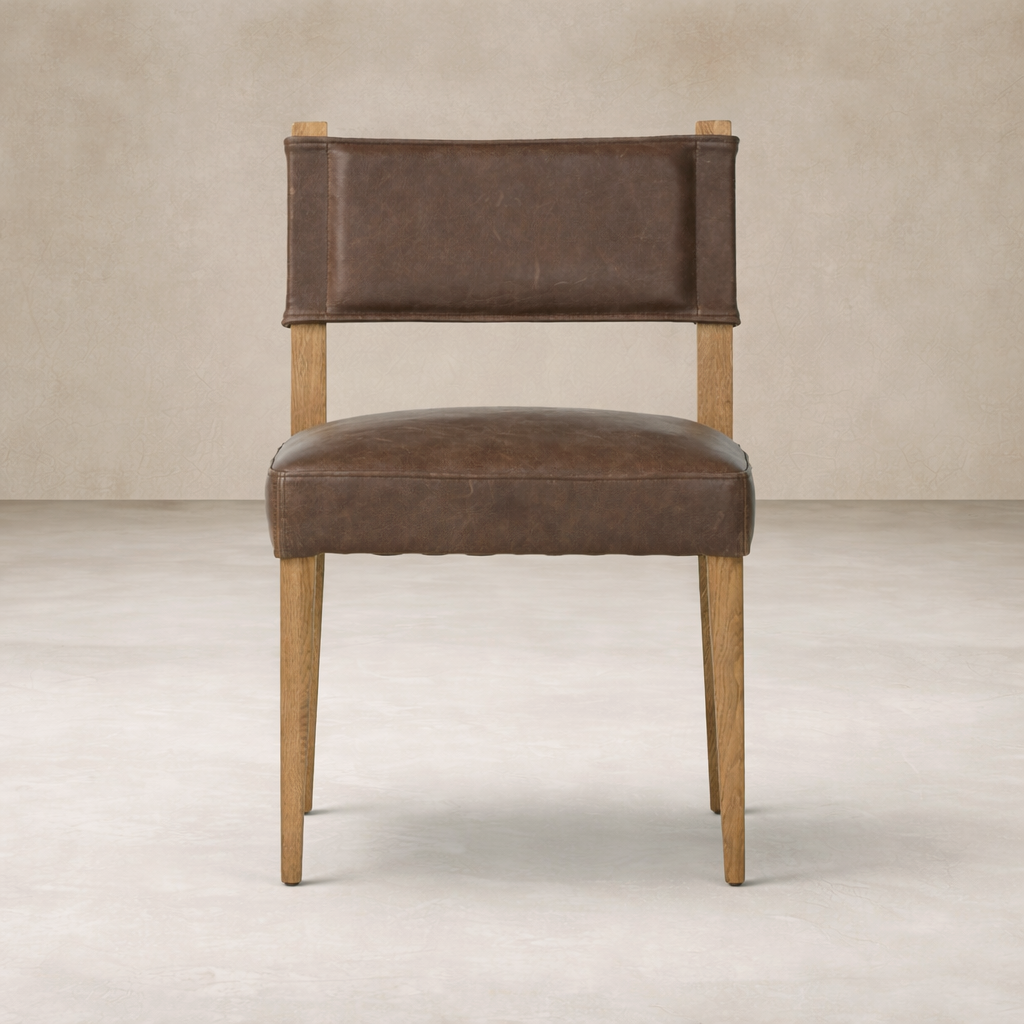 Front view of the Roseto Dining Chair featuring a rich brown leather seat and sturdy wooden legs.
