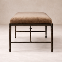 Front view of the Cannes Accent Bench featuring a soft brown upholstered seat and sturdy metal frame.