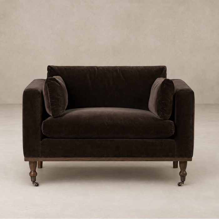 Brown velvet armchair on a beige background