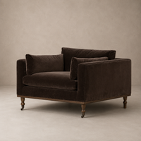 Brown velvet arm chair against a beige background