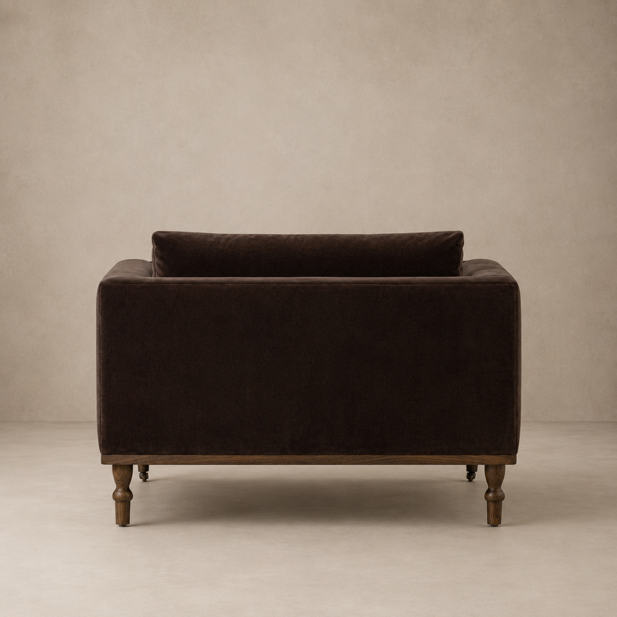 Brown velvet chair against a beige background