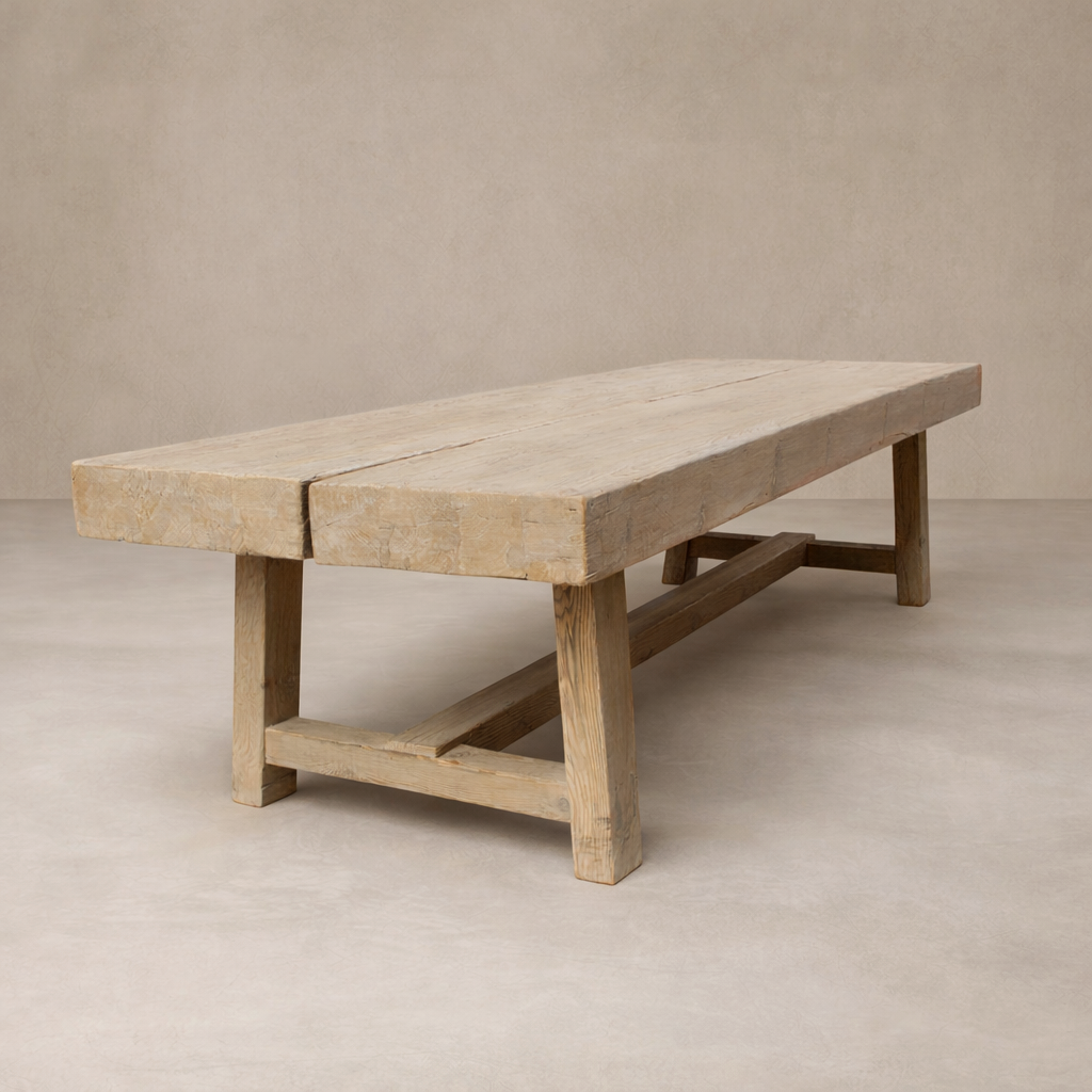 Three-quarter view of the Granada Vintage Elm Dining Table, showcasing its rustic wood finish and sturdy design.