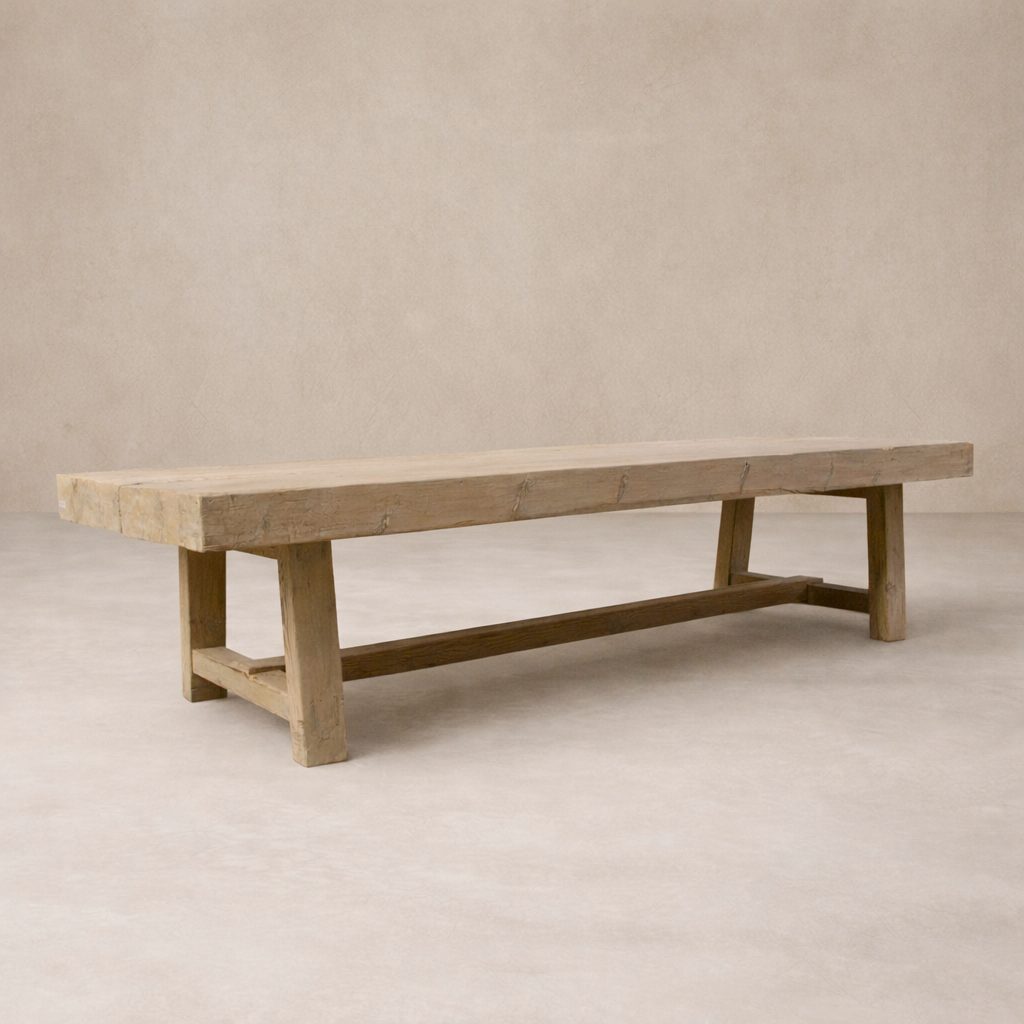 Side angle of the Granada Vintage Elm Dining Table showcasing its rustic finish and sturdy design.