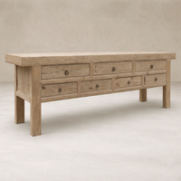 Front view of the Daphne Weathered Sideboard featuring a rustic wood finish and multiple drawers.