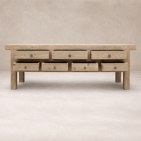 Front view of the Daphne Weathered Sideboard featuring a rustic finish and multiple drawers.