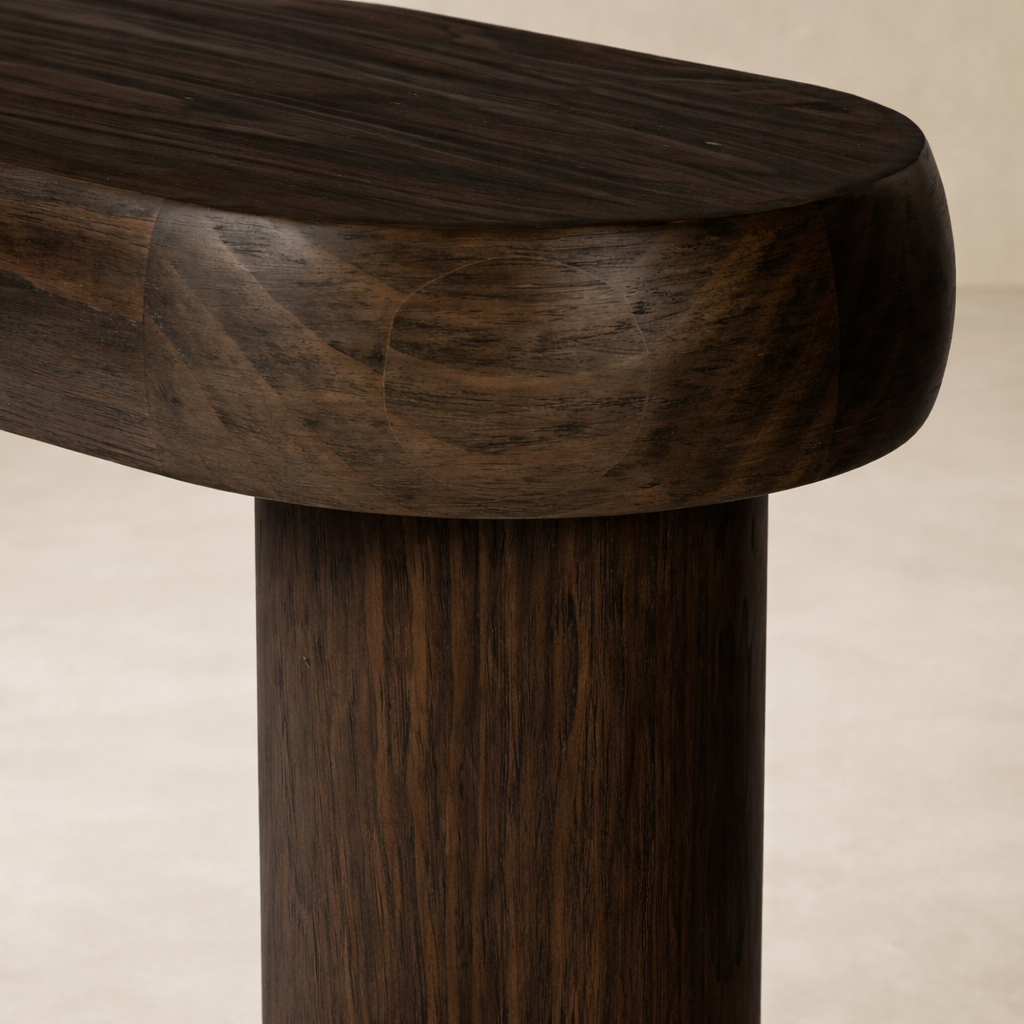Detail of the Maelle Console Table showcasing its smooth, rounded edges and rich wood grain finish.