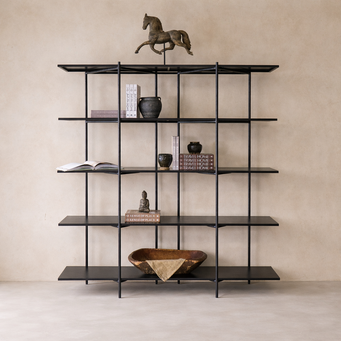 Three-quarter view of the Monaco Forged Iron Bookshelf showcasing its sleek black finish and open design.