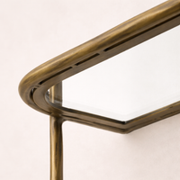 Close-up of the Winslow Shelf highlighting its elegant brass frame and glass surface.