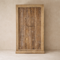 Front view of the Amaranth Vintage Haveli Door Bookshelf, showcasing rustic wood grain and sturdy craftsmanship.