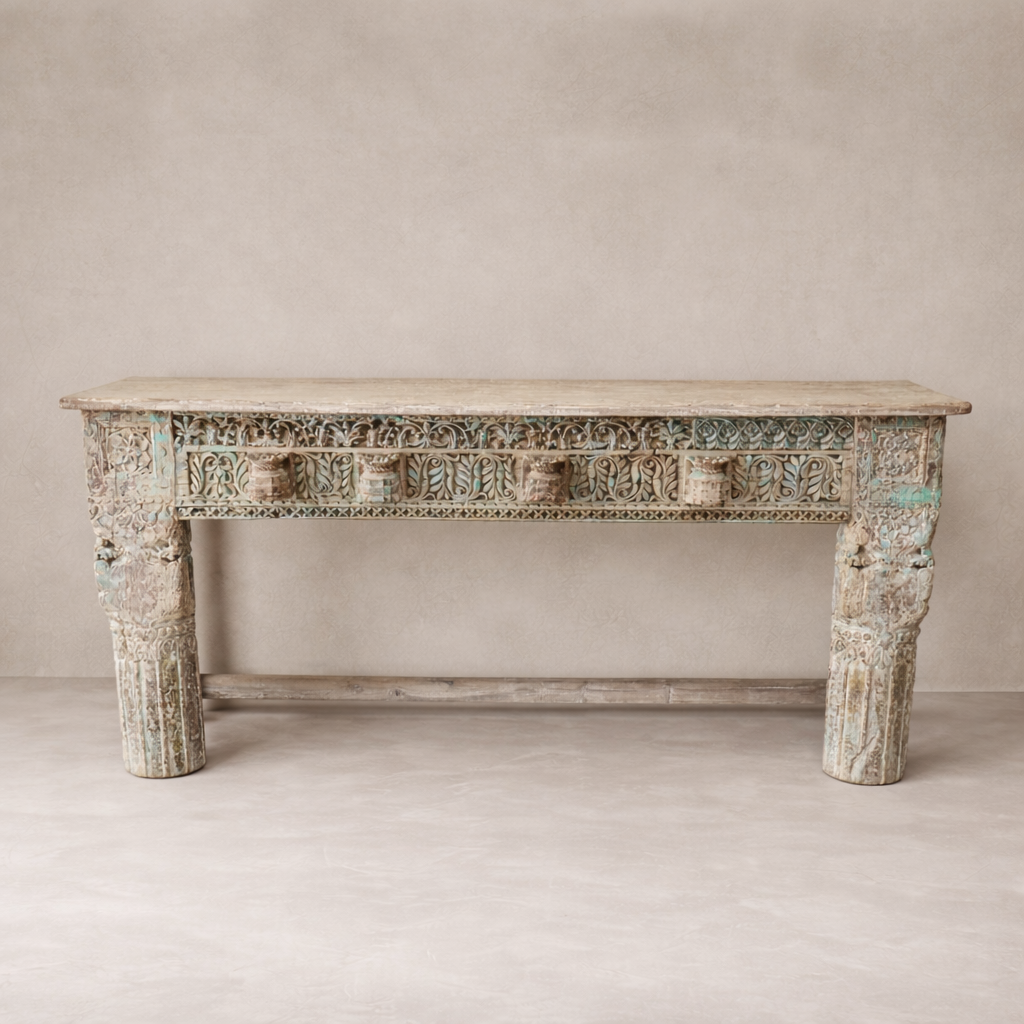 Front view of the Adana Carved Vintage Console Table showcasing intricate detailing and a weathered finish.