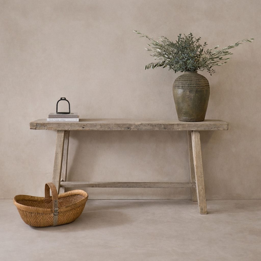 Rustic Rioja Vintage Teak Console Table styled with a decorative vase and books against a neutral backdrop.