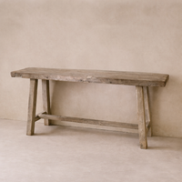 Rustic Rioja Vintage Teak Console Table with a natural finish and sturdy legs.